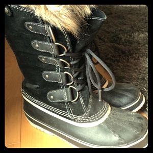 Sorel tall winter boots with fur.